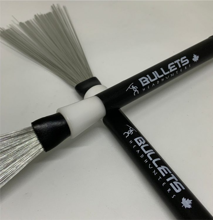 HeadHunters Bullets hybrid drum brush — tapered nylon sleeve + retractable wire for accent control, cymbal ping, and bell tones. Made in Canada.