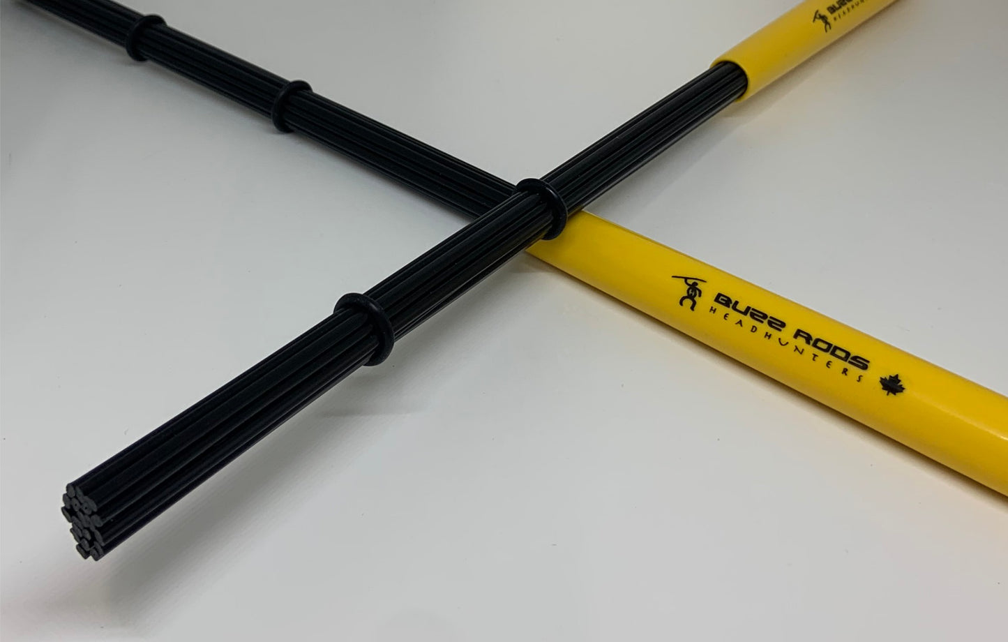 HeadHunters Buzz Rods — polypropylene rods in a soft flexible handle with 3 adjustable rings for variable percussive dynamics. Made in Canada.
