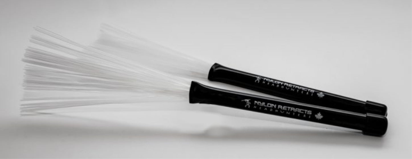 HeadHunters Nylon Retracts — white nylon filaments, black polycarbonate handle, fully retractable. Smooth, warm response, Made in Canada.
