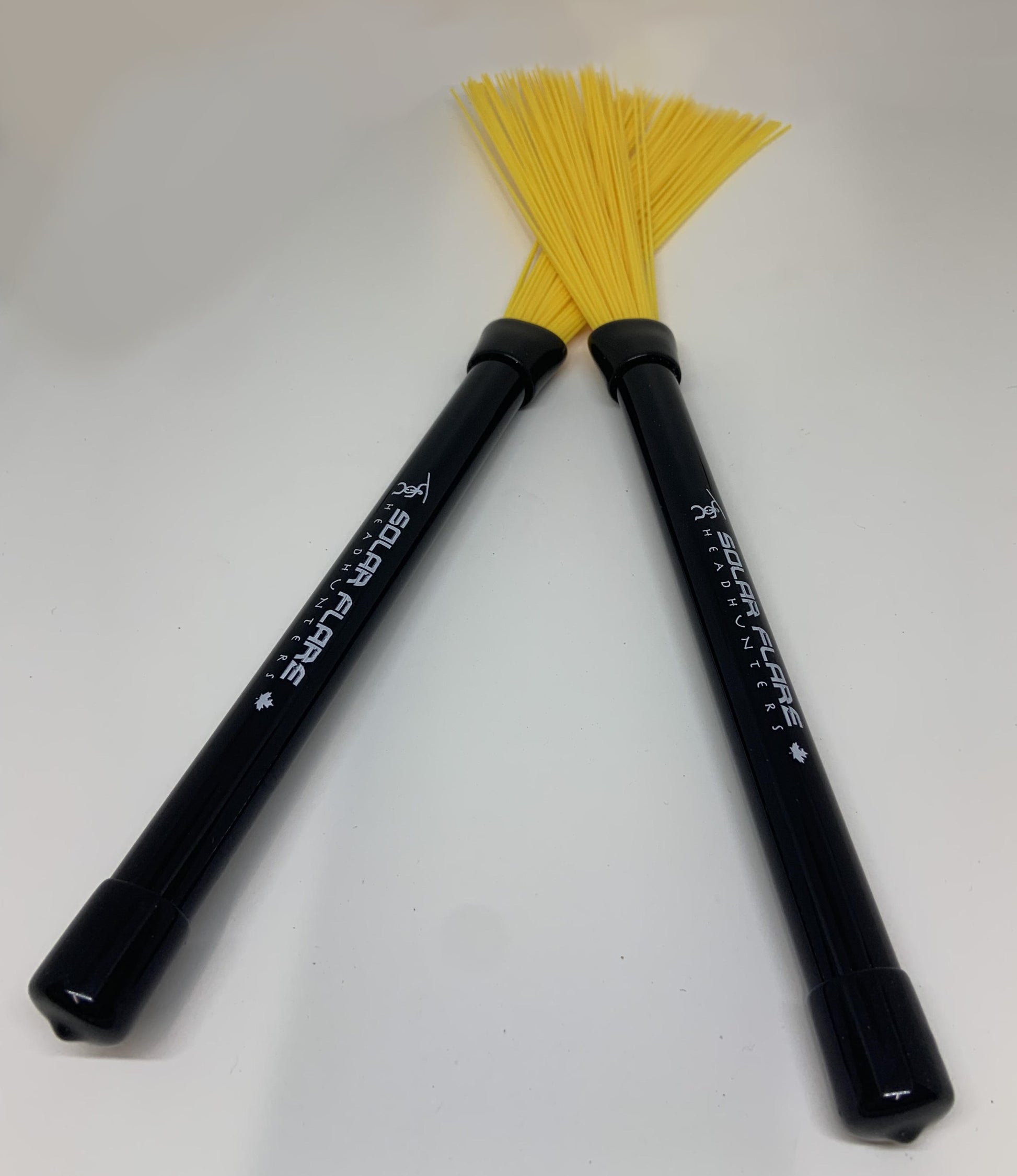 HeadHunters Solar Flares — yellow nylon retractable drum brushes in black polycarbonate handle. Smooth, warm response, Made in Canada.